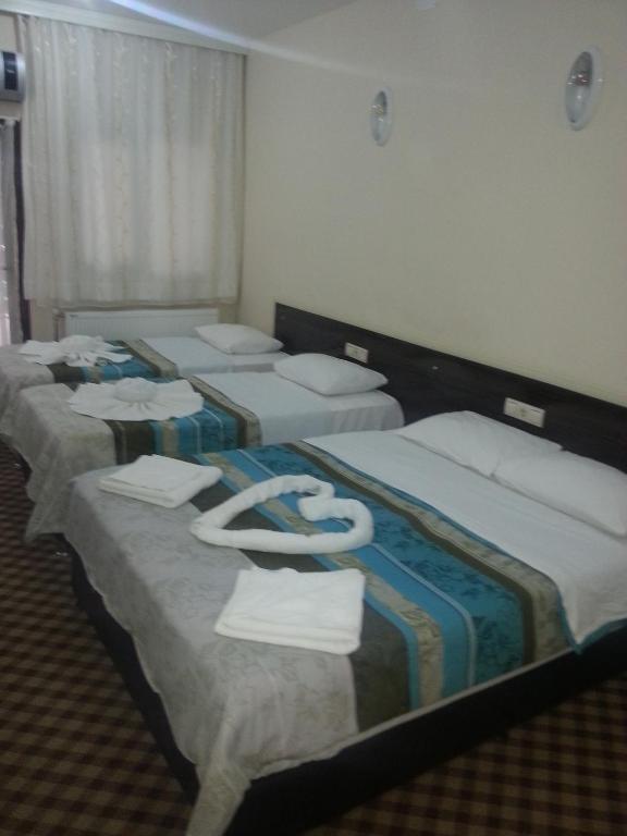 Postel nebo postele na pokoji v ubytování Anatolia Hotel