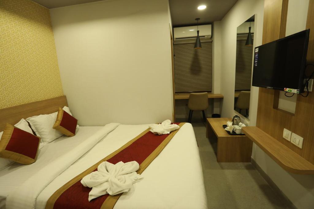 Postel nebo postele na pokoji v ubytování VIPs Hotel Olive
