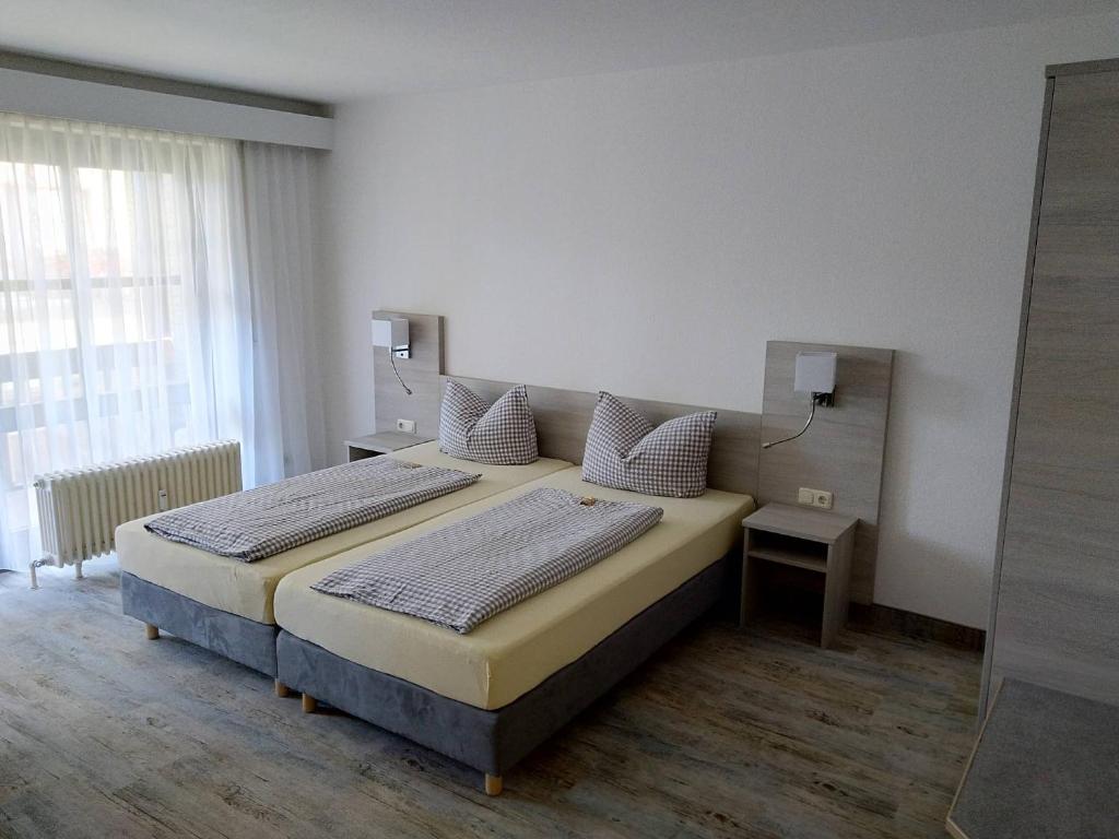 Postel nebo postele na pokoji v ubytování Hotel Fortuna