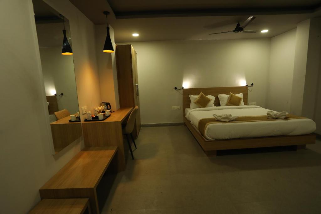 Postel nebo postele na pokoji v ubytování VIPs Hotel Olive
