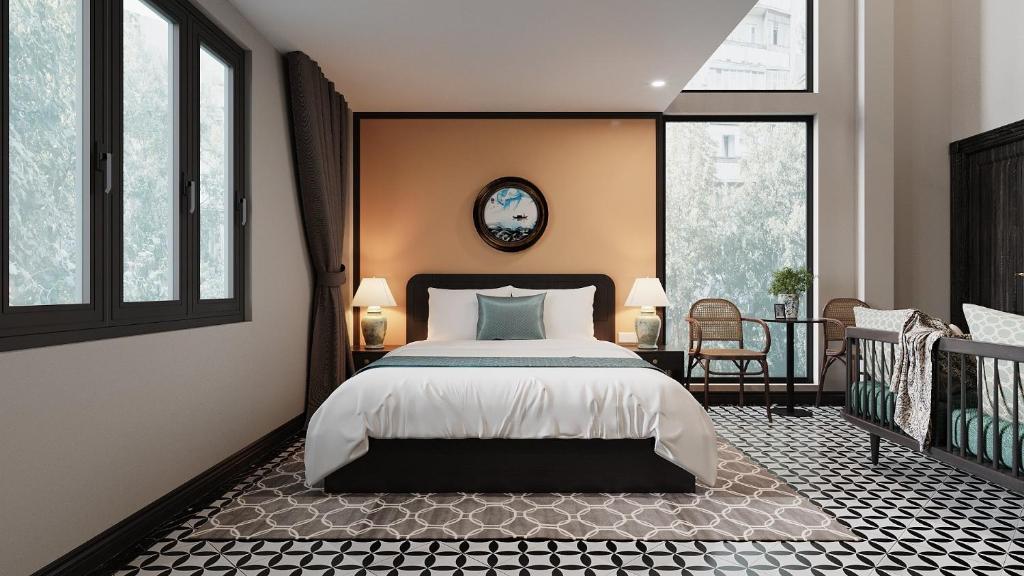 Un pat sau paturi într-o cameră la ĐẠI THỦY Hotel