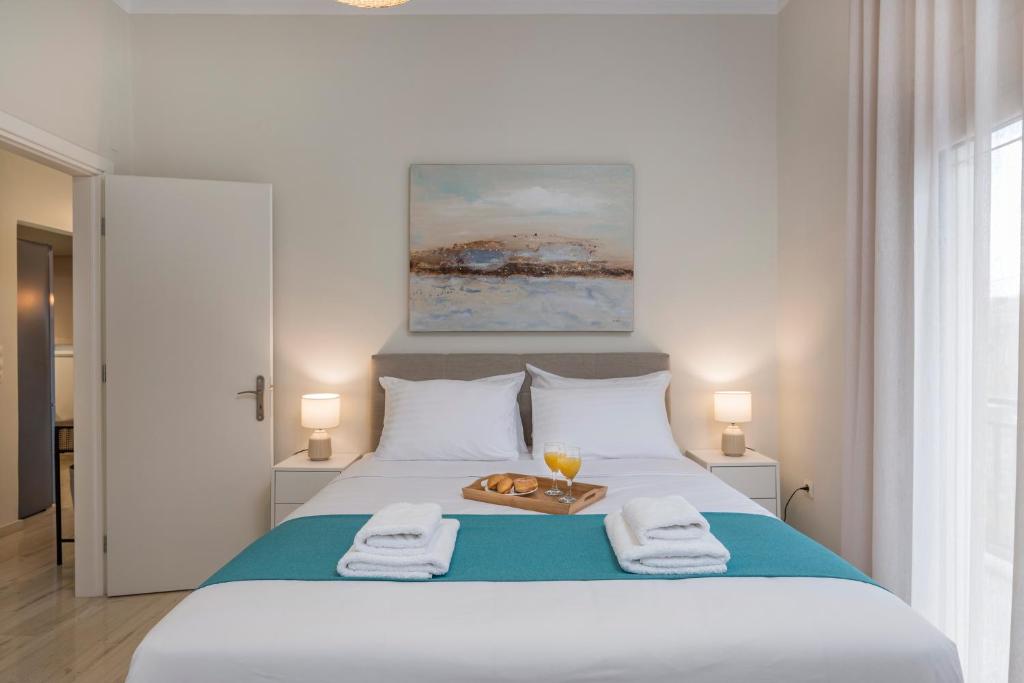 A bed or beds in a room at Old Harbor Apartment Luxury Living Chania