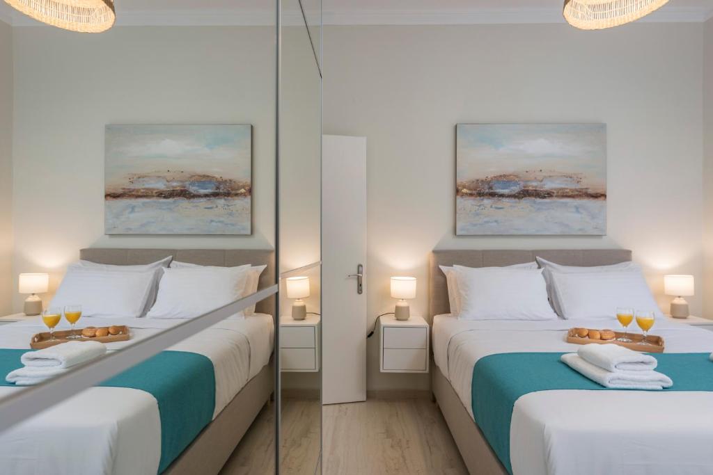 A bed or beds in a room at Old Harbor Apartment Luxury Living Chania