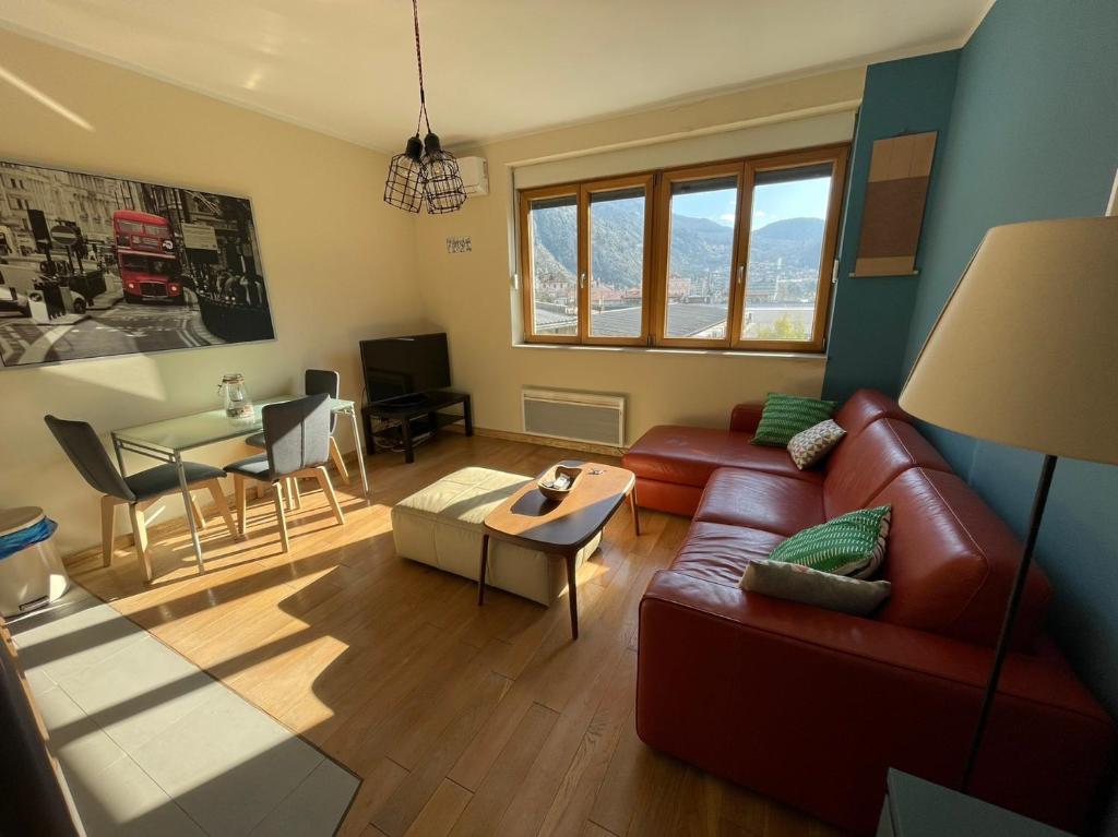 a living room with a couch and a table at Downtown Apartment in Kotor