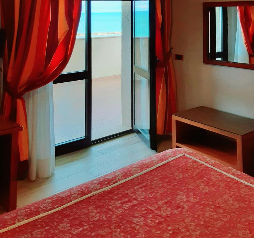 Postel nebo postele na pokoji v ubytování Hotel Promenade