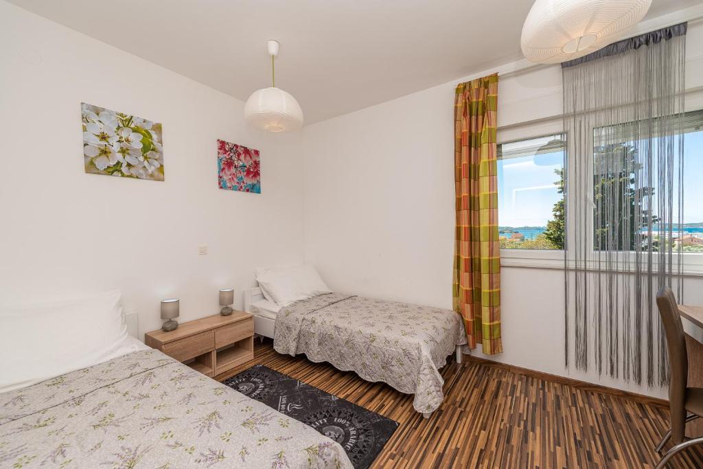 Posteľ alebo postele v izbe v ubytovaní Antonio Apartments