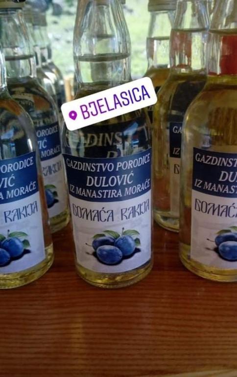 a group of bottles of alcohol on a table at Dulović - KATUN POTOCI in Kolašin