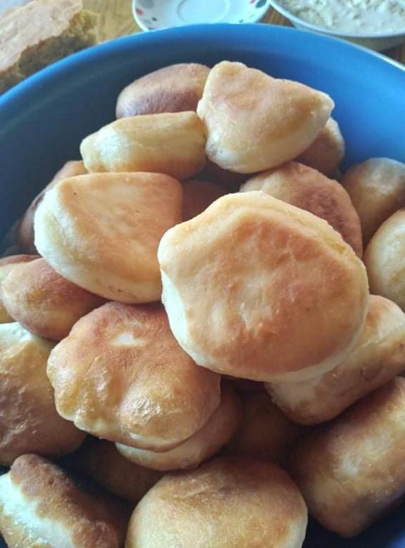 a pile of donuts in a blue bowl at Dulović - KATUN POTOCI in Kolašin