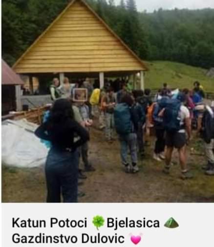 a group of people standing in front of a building at Dulović - KATUN POTOCI in Kolašin