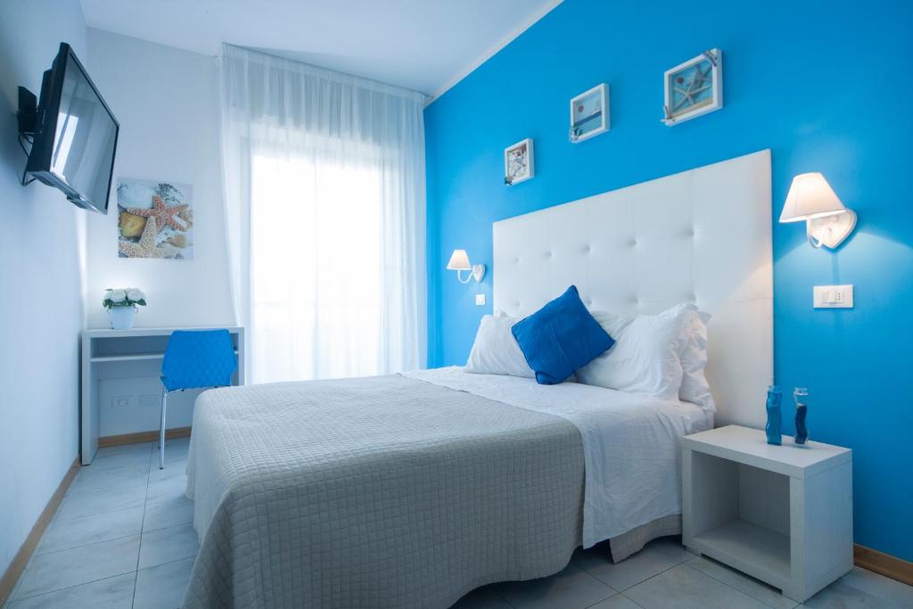 Postel nebo postele na pokoji v ubytování Hotel Betty Personal Style and Beach Village
