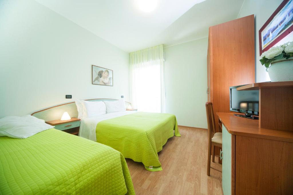 Postel nebo postele na pokoji v ubytování Hotel Betty Personal Style and Beach Village