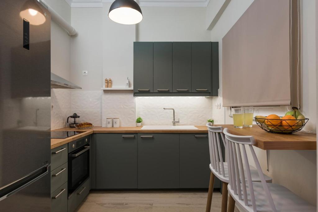 A kitchen or kitchenette at Old Harbor Apartment Luxury Living Chania