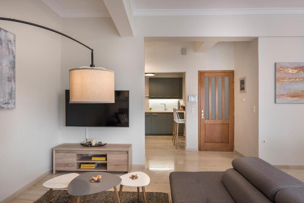 A television and/or entertainment centre at Old Harbor Apartment Luxury Living Chania