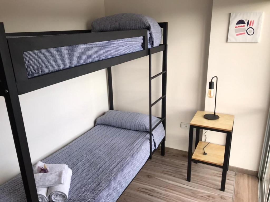 Dviaukštė lova arba lovos apgyvendinimo įstaigoje Vista Andina Apartments