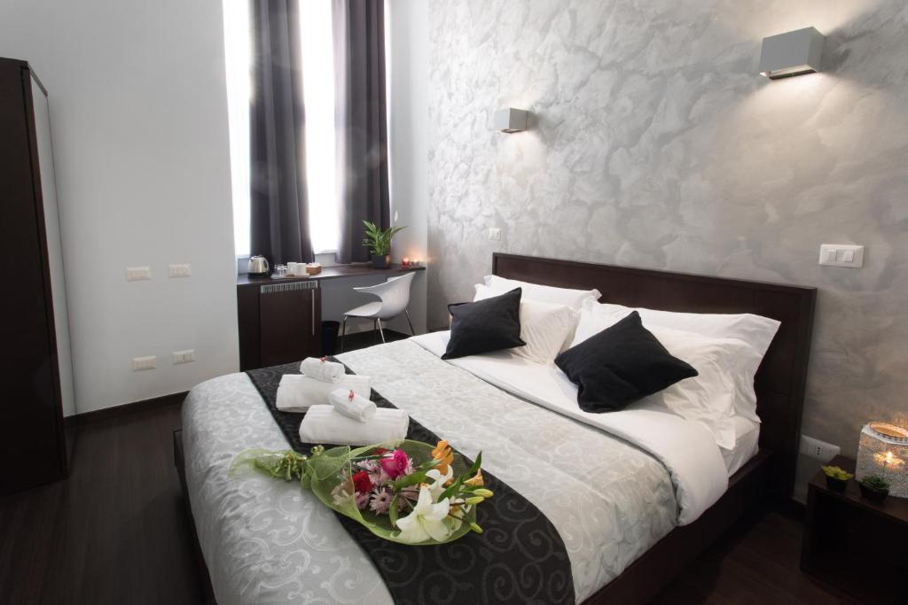 A bed or beds in a room at Chroma Italy - Chroma Pente