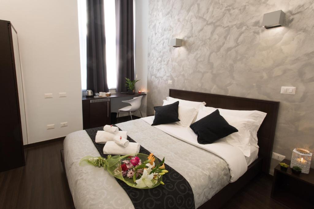 A bed or beds in a room at Chroma Italy - Chroma Pente