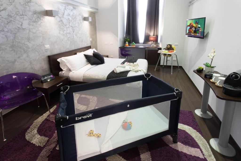 A bed or beds in a room at Chroma Italy - Chroma Pente