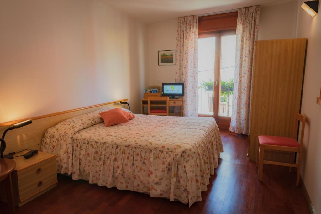 Postel nebo postele na pokoji v ubytování Hotel Zeni