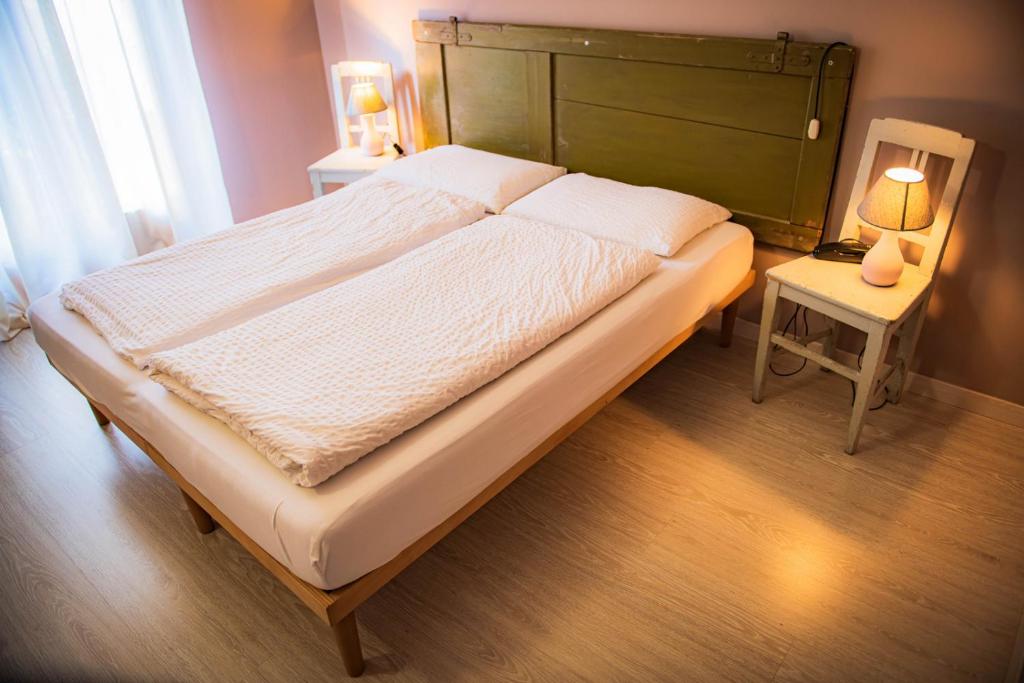 Postel nebo postele na pokoji v ubytování Hotel Zeni