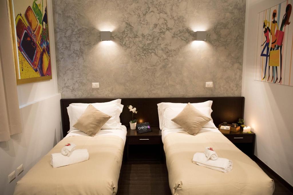 A bed or beds in a room at Chroma Italy - Chroma Pente