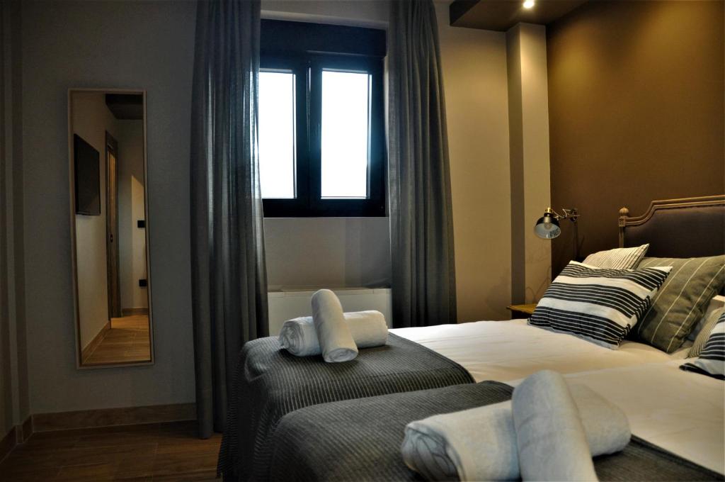Posteľ alebo postele v izbe v ubytovaní Apartamentos Las Agüeras
