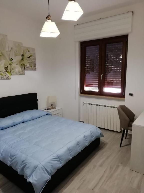 Łóżko lub łóżka w pokoju w obiekcie B&B Bovianum