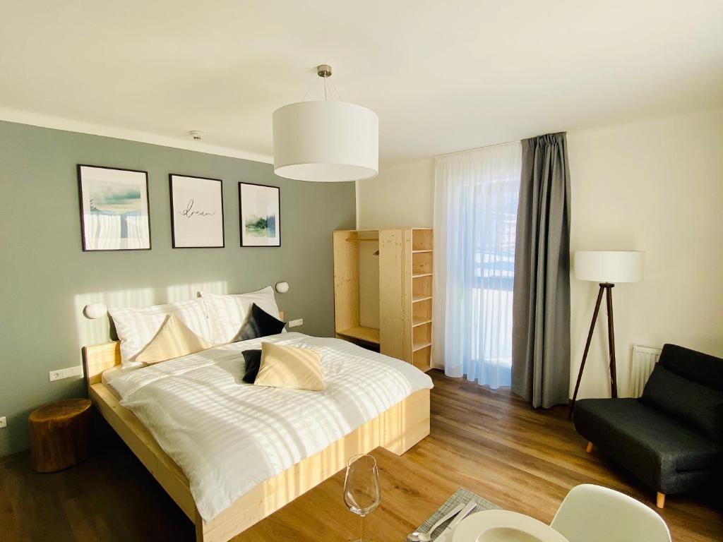 A bed or beds in a room at Haus Stadler - Self Check-in