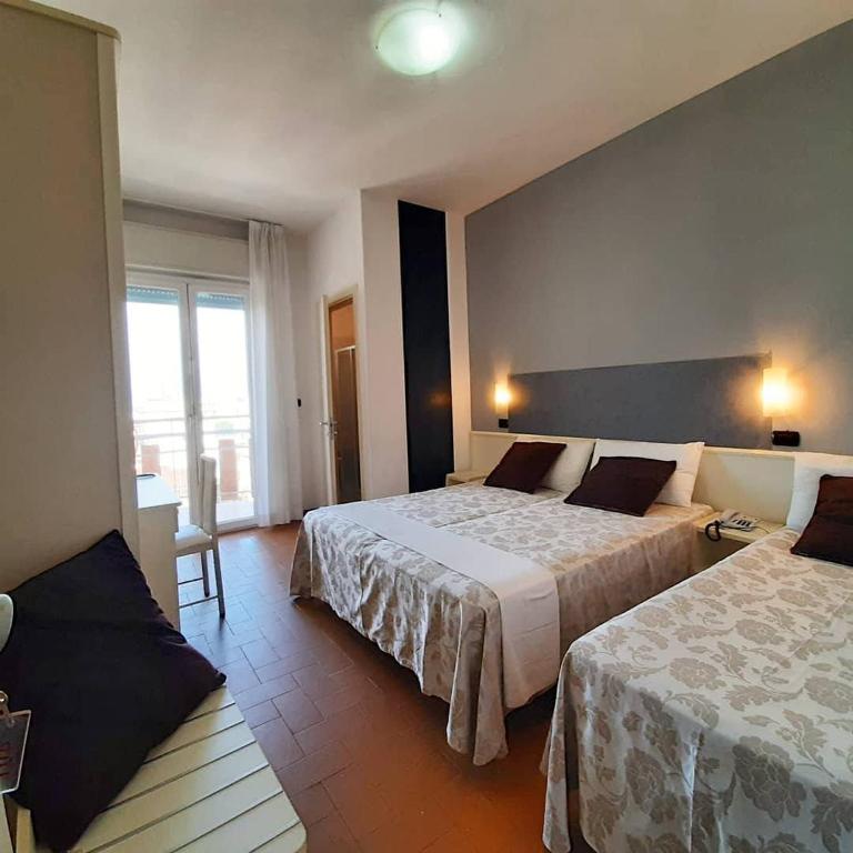 Postel nebo postele na pokoji v ubytování HOTEL CONTI