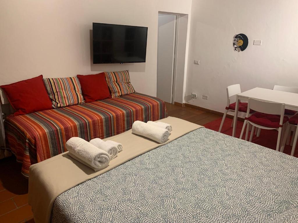 Łóżko lub łóżka w pokoju w obiekcie La casa del Centro