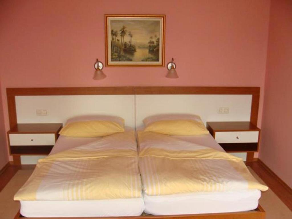 Postel nebo postele na pokoji v ubytování Hotel Delminium
