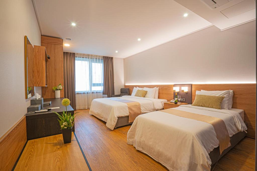 Postel nebo postele na pokoji v ubytování Embledon Hotel