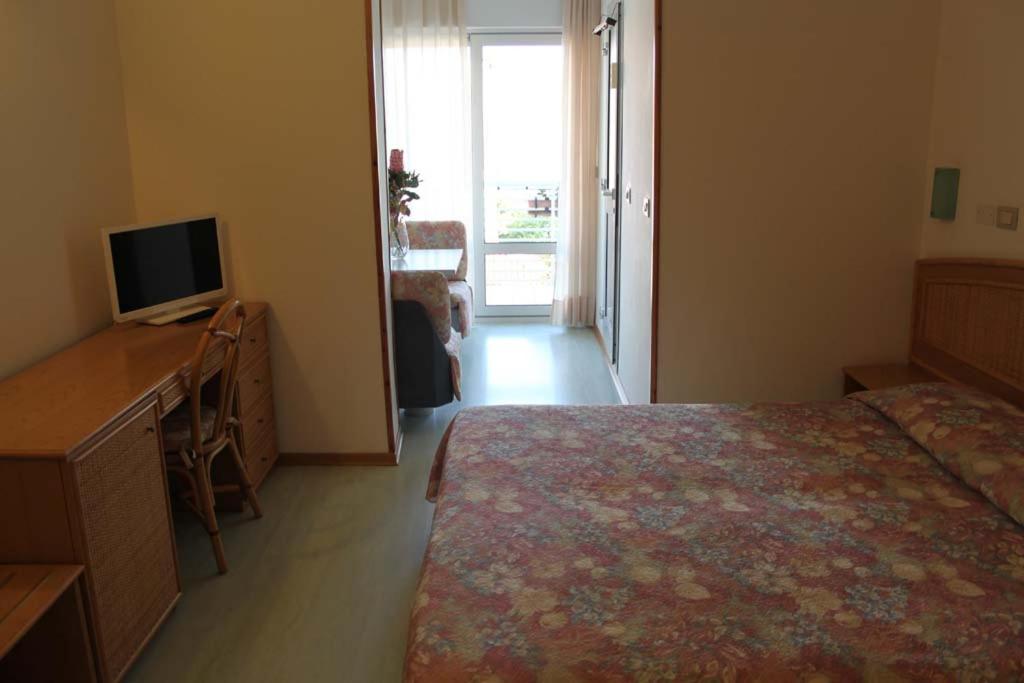 Postel nebo postele na pokoji v ubytování Hotel Capri