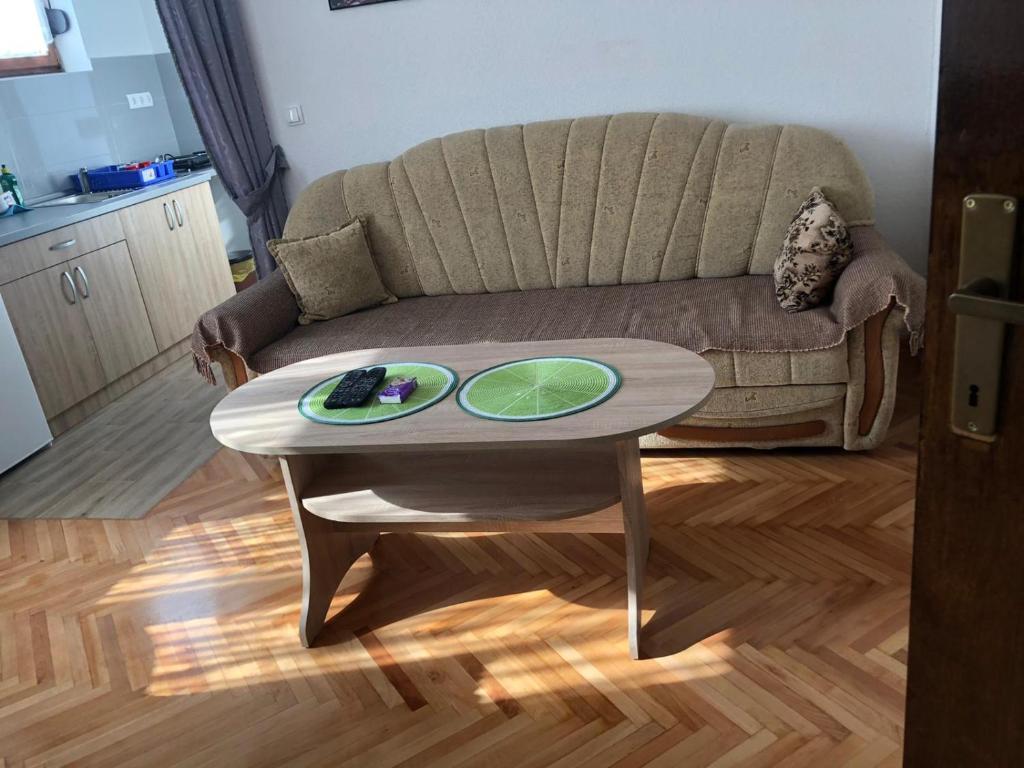 a living room with a couch and a coffee table at Apartment Sara in Mostar