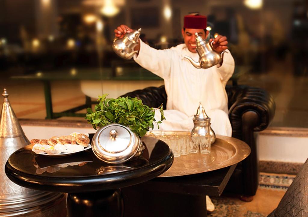 Een restaurant of ander eetgelegenheid bij Royal Mirage Agadir