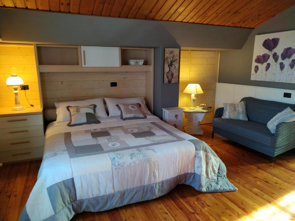 Łóżko lub łóżka w pokoju w obiekcie Bed And Breakfast Olimpia