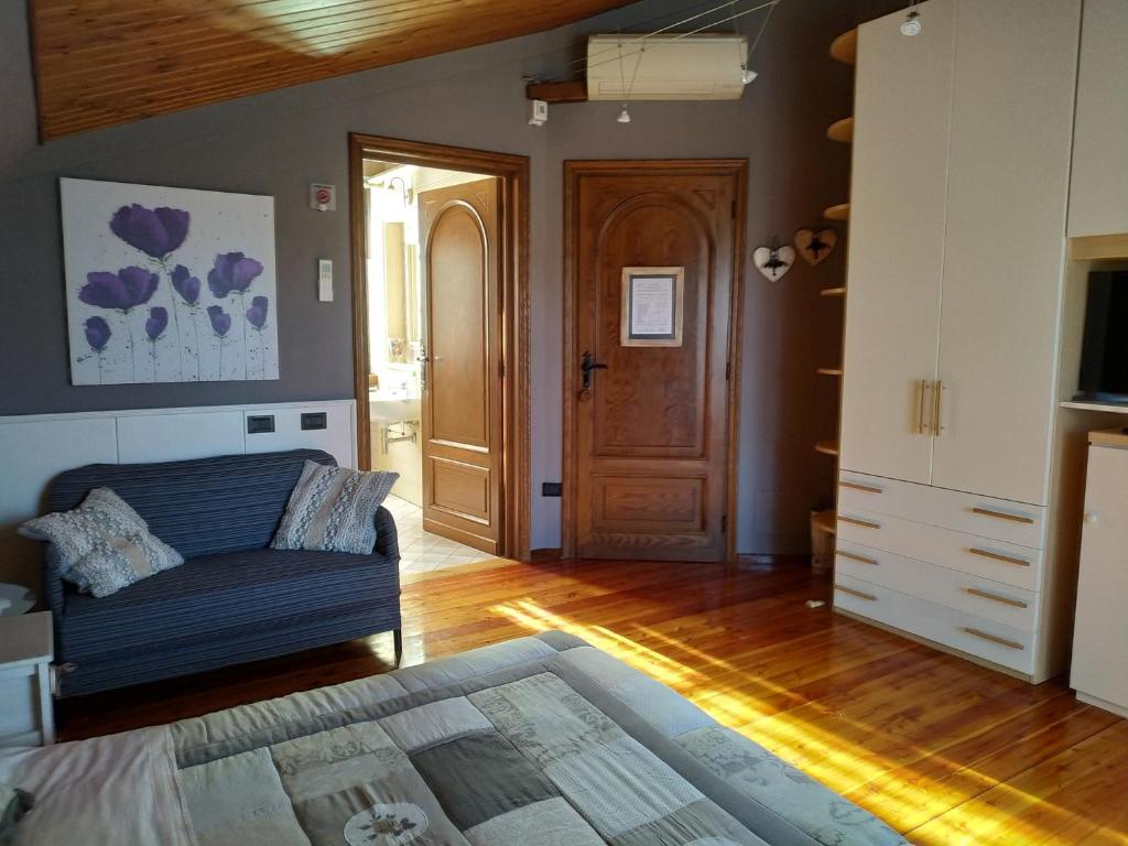 Łóżko lub łóżka w pokoju w obiekcie Bed And Breakfast Olimpia