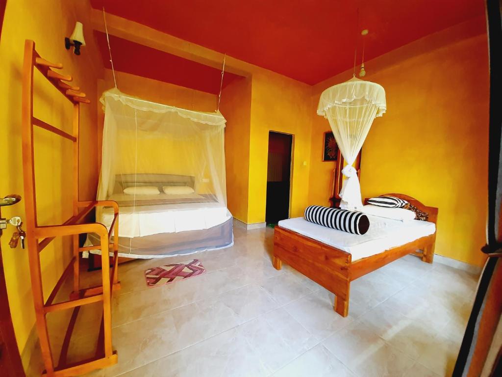 Postel nebo postele na pokoji v ubytování Serenity Homestay
