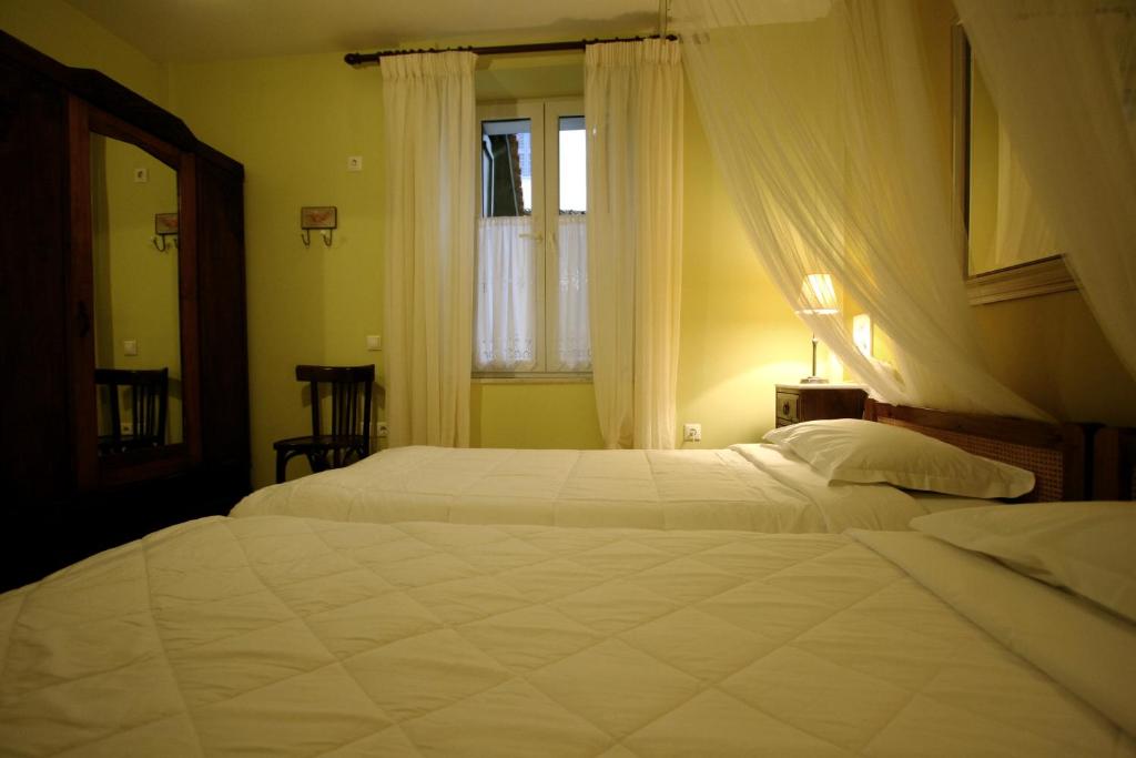 Postel nebo postele na pokoji v ubytování Meliti Guesthouse