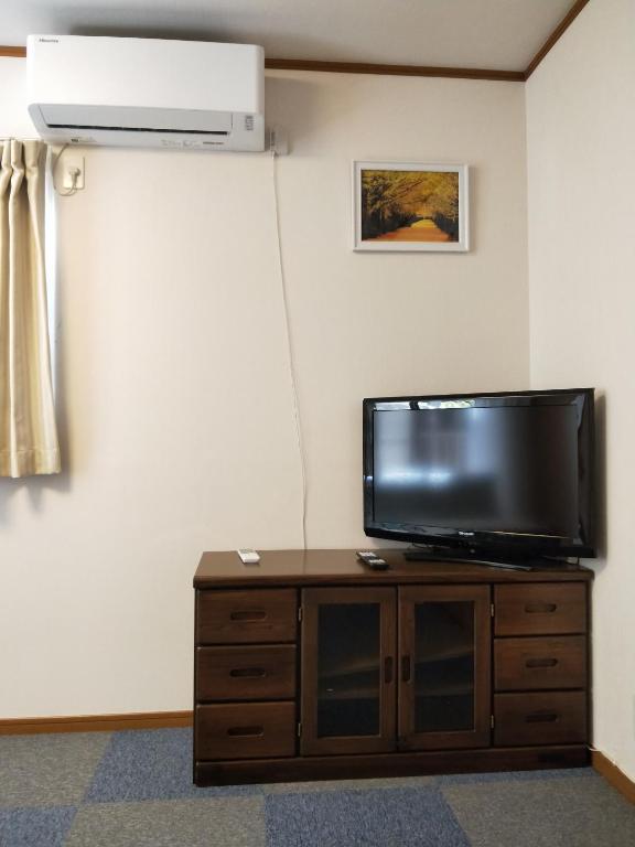 TV a/nebo společenská místnost v ubytování Izu Shirada Villa 伊豆白田家