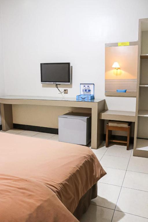 TV a/nebo společenská místnost v ubytování Hotel Pesona Merak