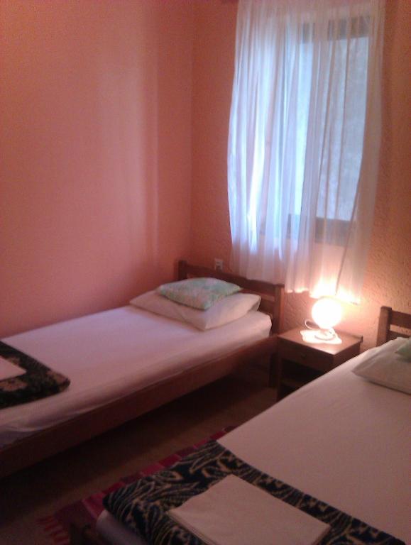 Postel nebo postele na pokoji v ubytování Roza Guest House