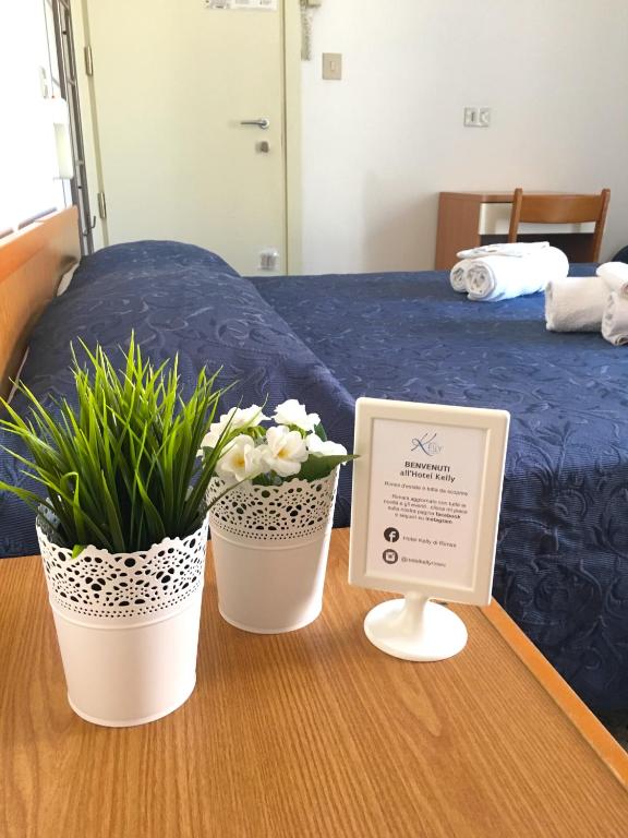 Postel nebo postele na pokoji v ubytování Hotel Kelly