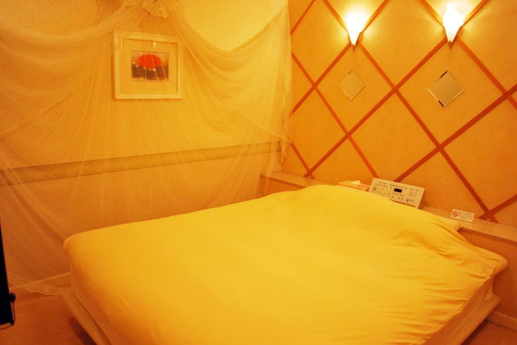 Postel nebo postele na pokoji v ubytování Ena Hotel Venus