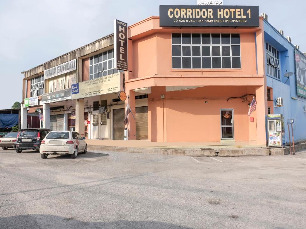 a building with a car parked in front of it at SPOT ON 90144 Corridor Hotel 1 in Pekan