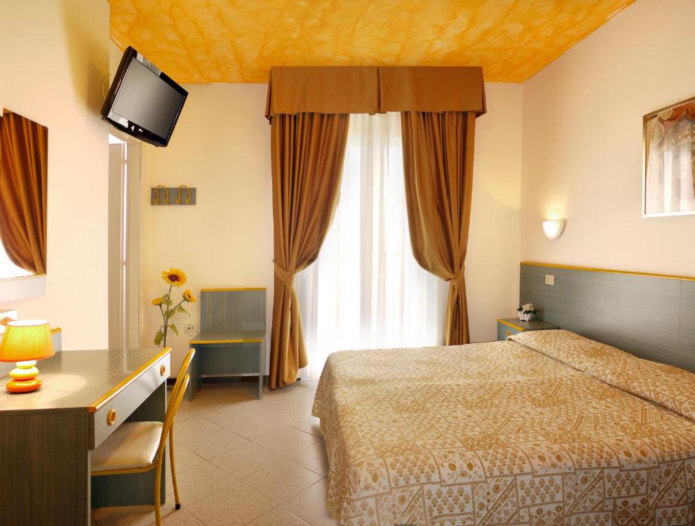 Postel nebo postele na pokoji v ubytování Hotel Storione