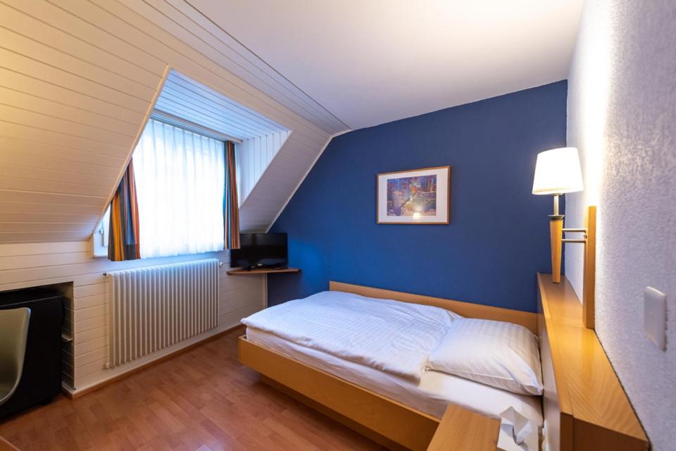 Postel nebo postele na pokoji v ubytování Les Negociants