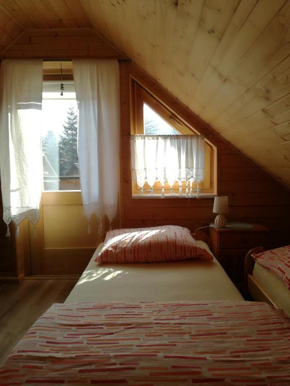 Postel nebo postele na pokoji v ubytování Domki Na Źródlanej
