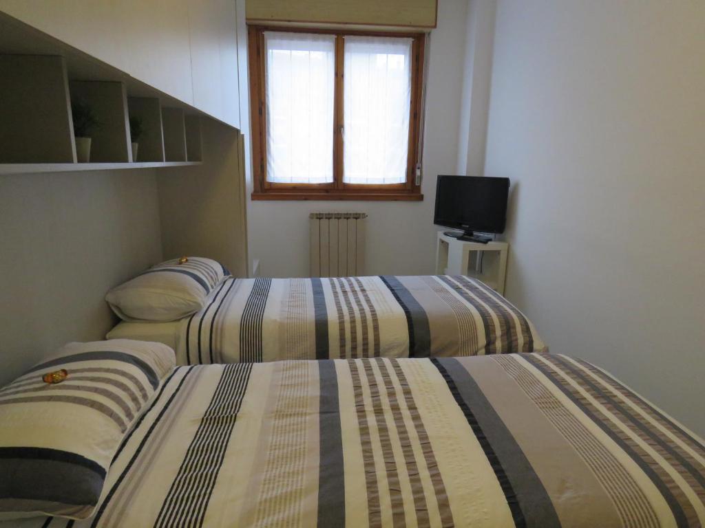 TV a/nebo společenská místnost v ubytování Assago Forum Apartment