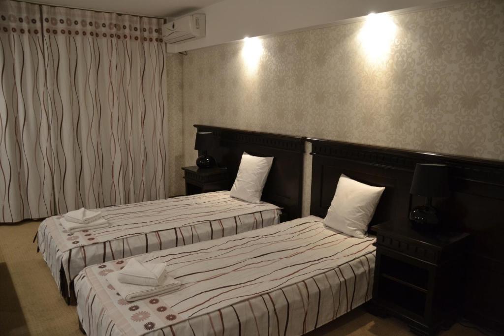 Posteľ alebo postele v izbe v ubytovaní Hotel Condor