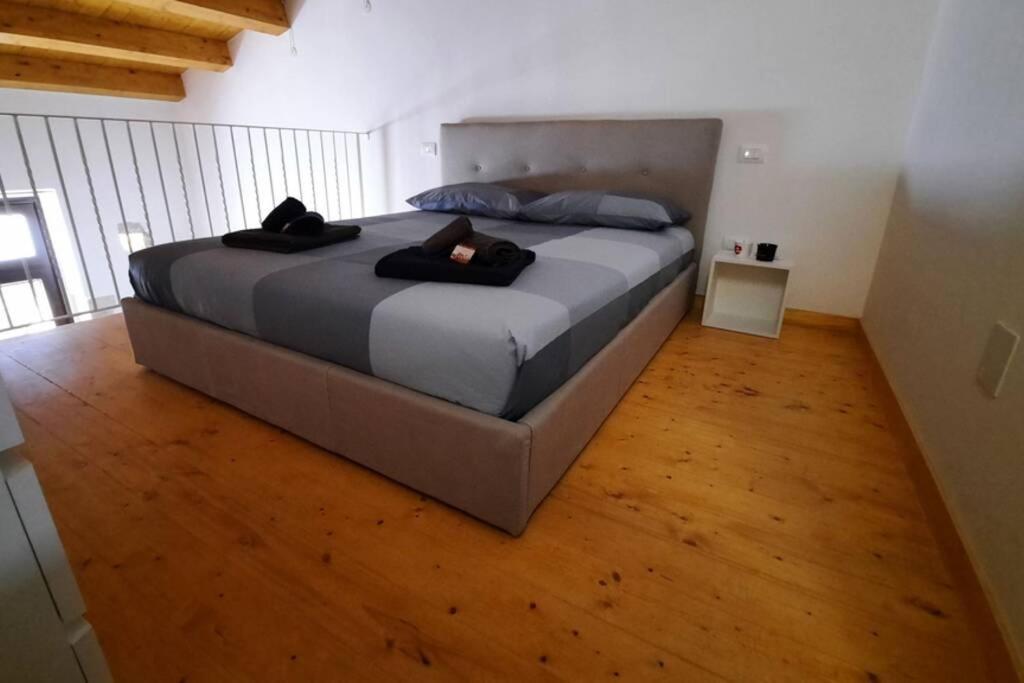 Postel nebo postele na pokoji v ubytování Casa Andolina Suprema